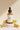 Vitamin C Brightening Serum on luxury stone pedestal with orange slices