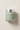 Daily Moisturizing Cream frosted glass jar on warm beige background